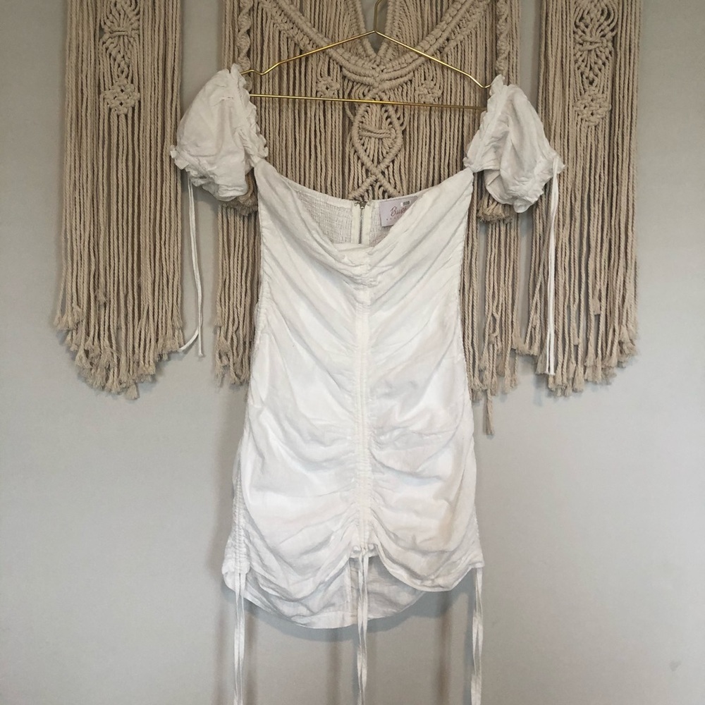 White mini dress with ruching and ties 👀🔥